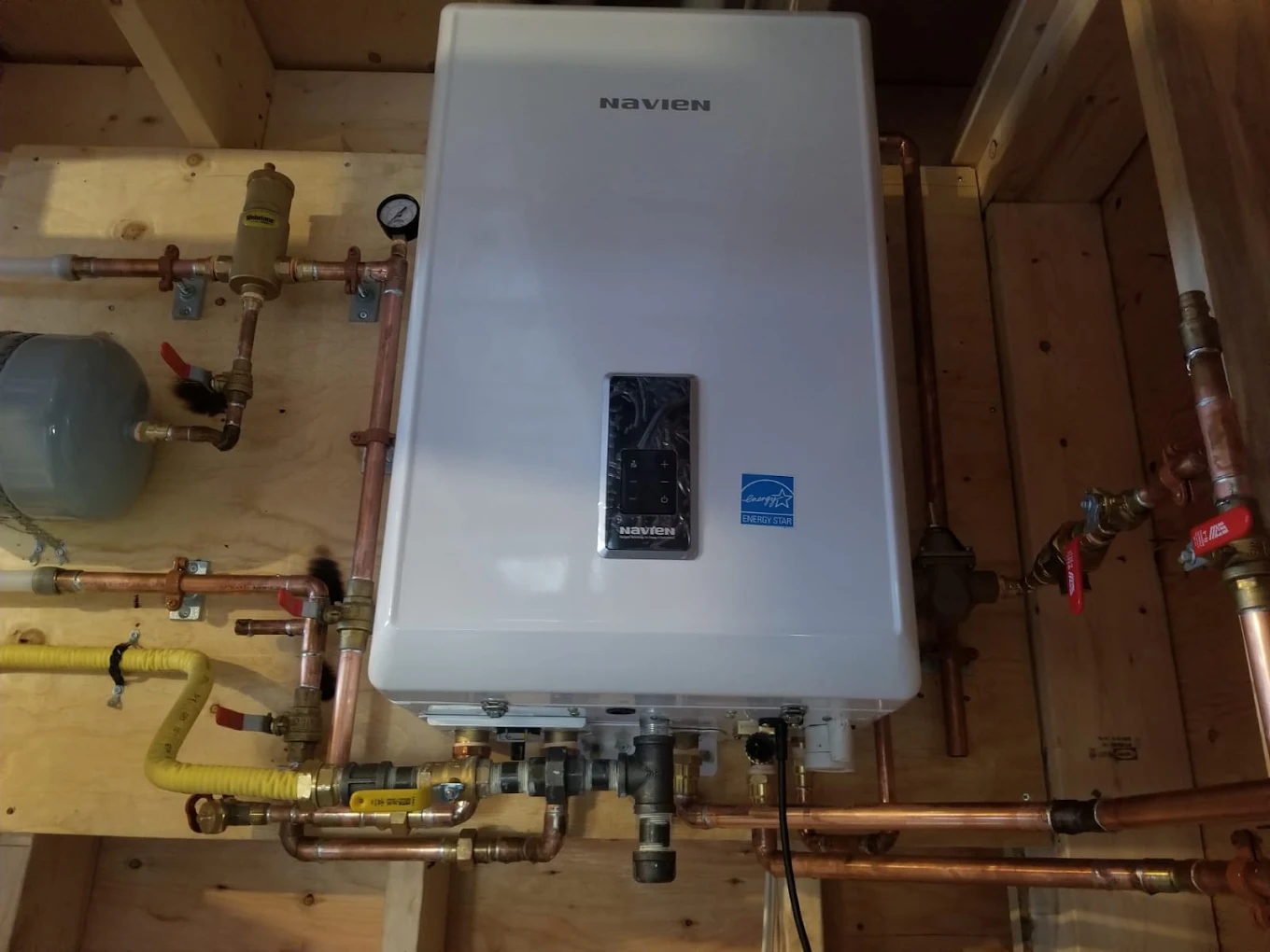 Navien tankless water heater installed with copper piping